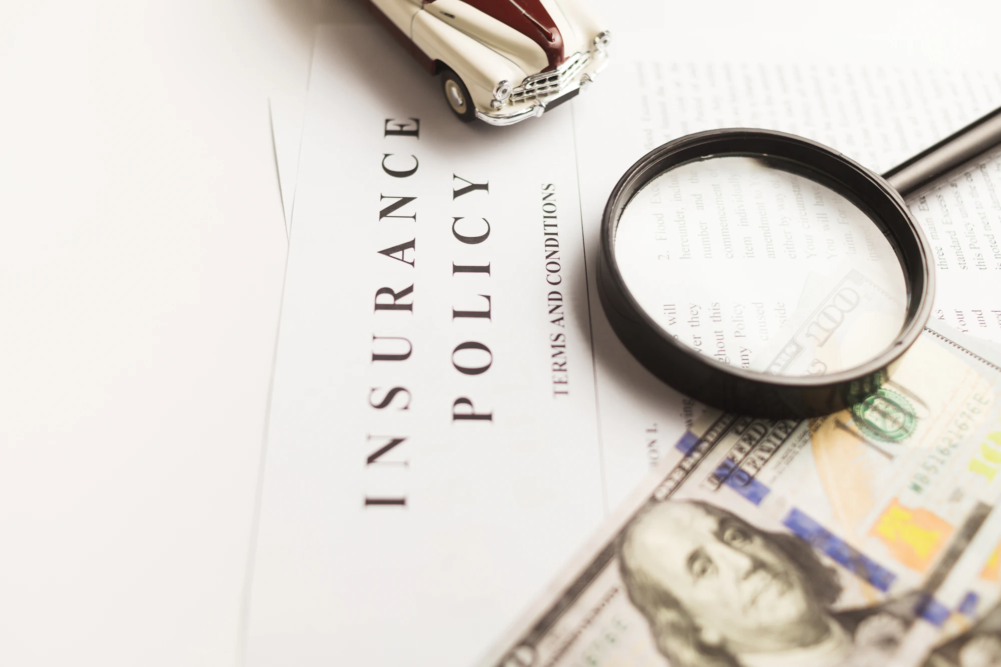 An insurance policy under a magnifying glass